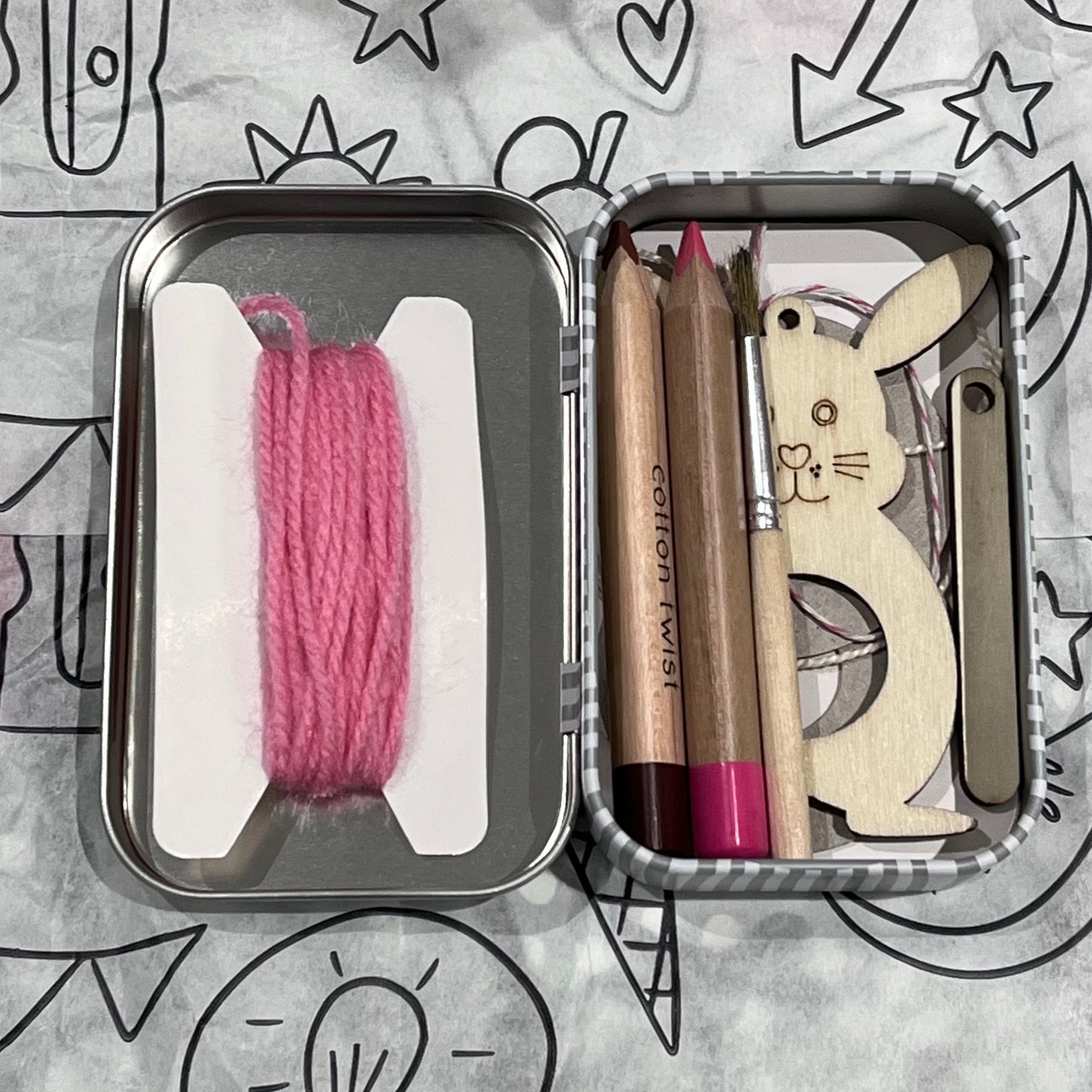 Plastic-free kids pom-pom bunny craft kit with wooden bunny cutout, wool, watercolor pencils, brush, and wooden needle, box open