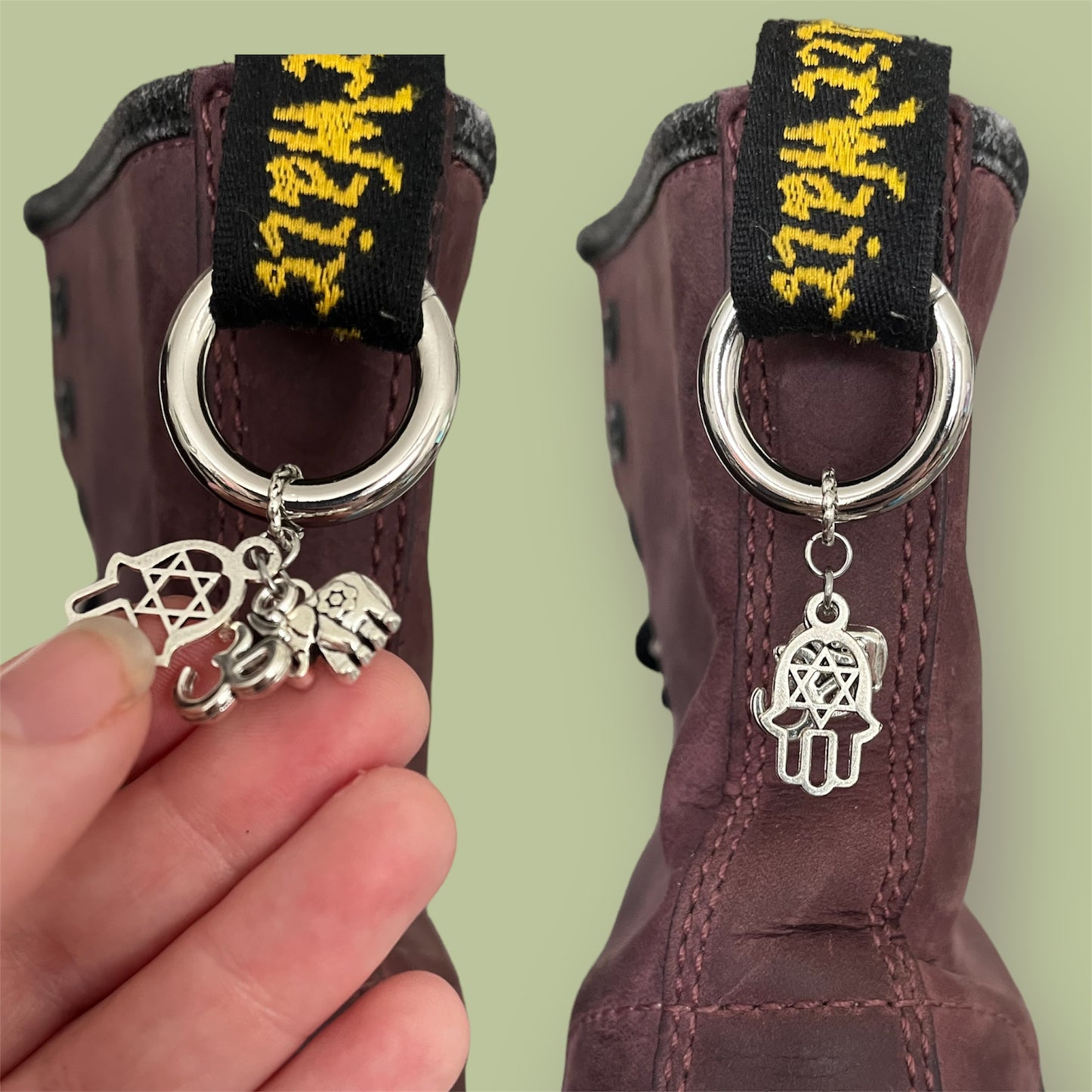 Close-up of handmade silver boot charms with Hamsa hand, ohm symbol, and elephant designs clipped onto black boot tabs