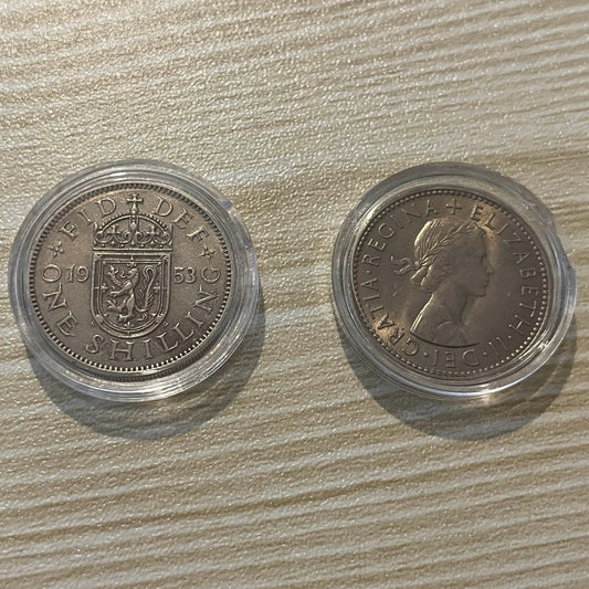 Queen Elizabeth II silver one shilling coins in protective capsules, obverse and reverse