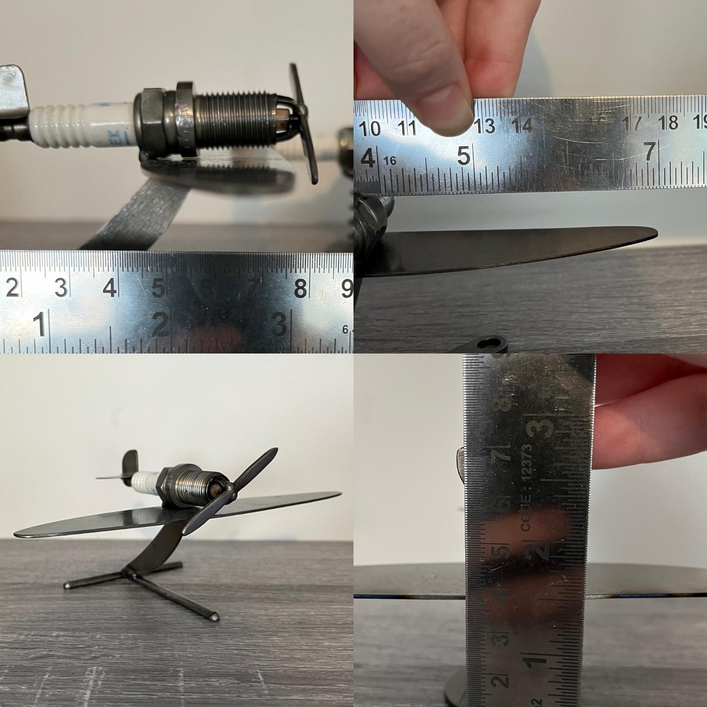 Handmade scrap metal airplane sculpture with propeller and angled stand, crafted from spark plug and recycled steel parts, industrial aviation décor gift showing measurements.