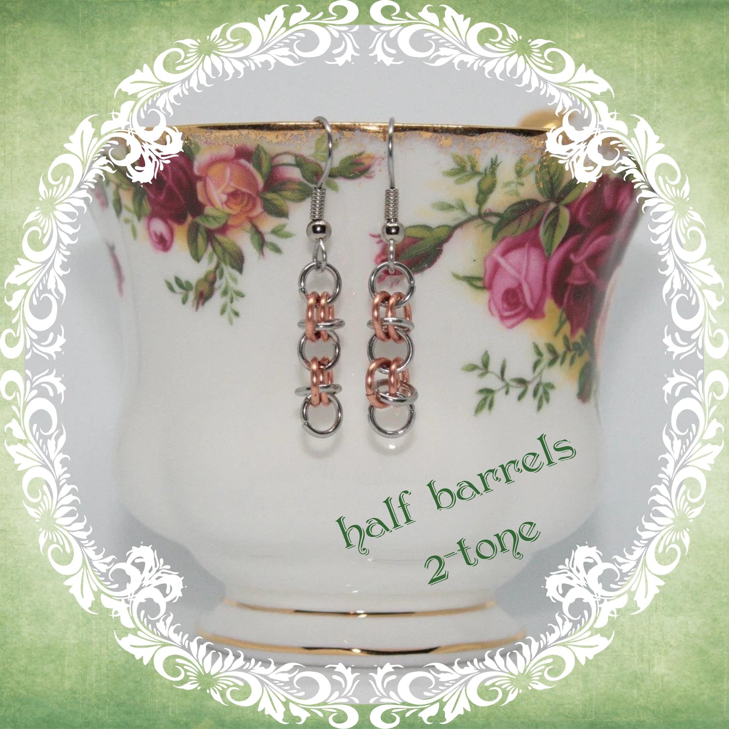 Handmade stainless steel and copper chainmail dangle earrings shown on vintage floral teacup, modern medieval fashion accessory, half barrels design