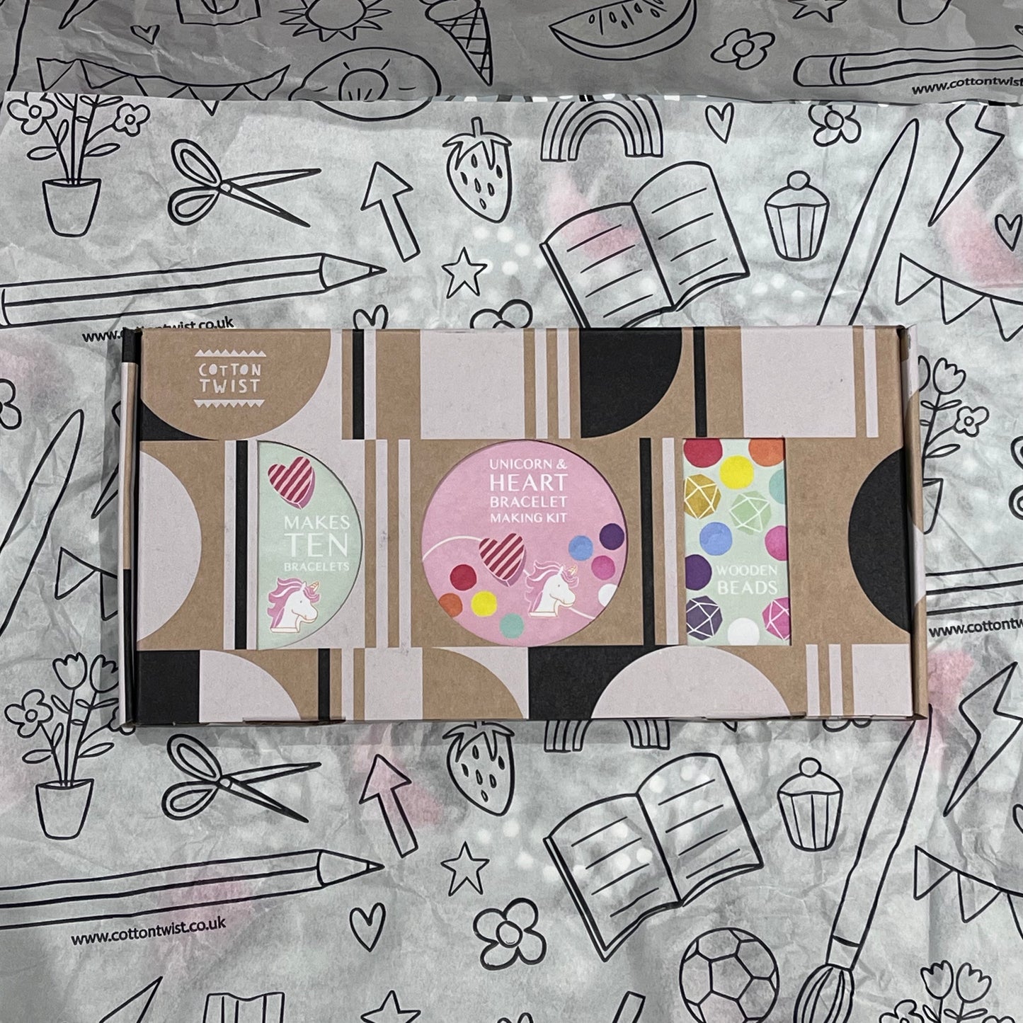 Plastic-free kids unicorn and heart bracelet kit with wooden beads, and elastic, box closed