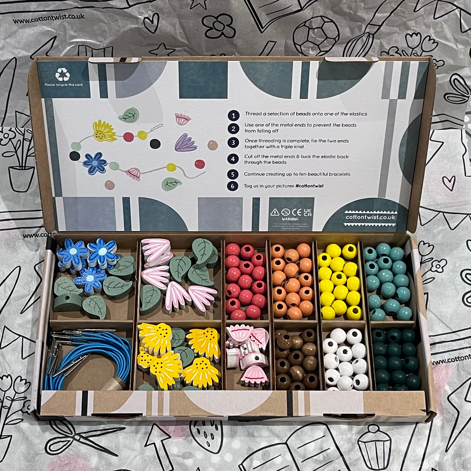 Plastic-free kids wildflower bracelet kit with wooden beads, and elastic, box open
